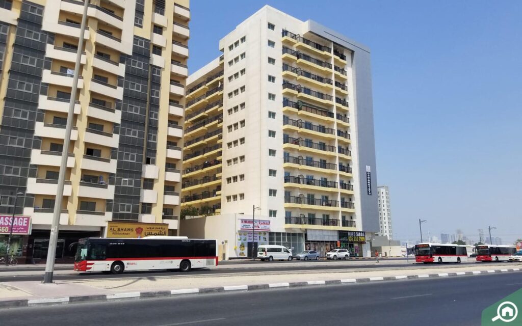 buses in front of Al Hassani Building 19 Dubai, Al Nahda