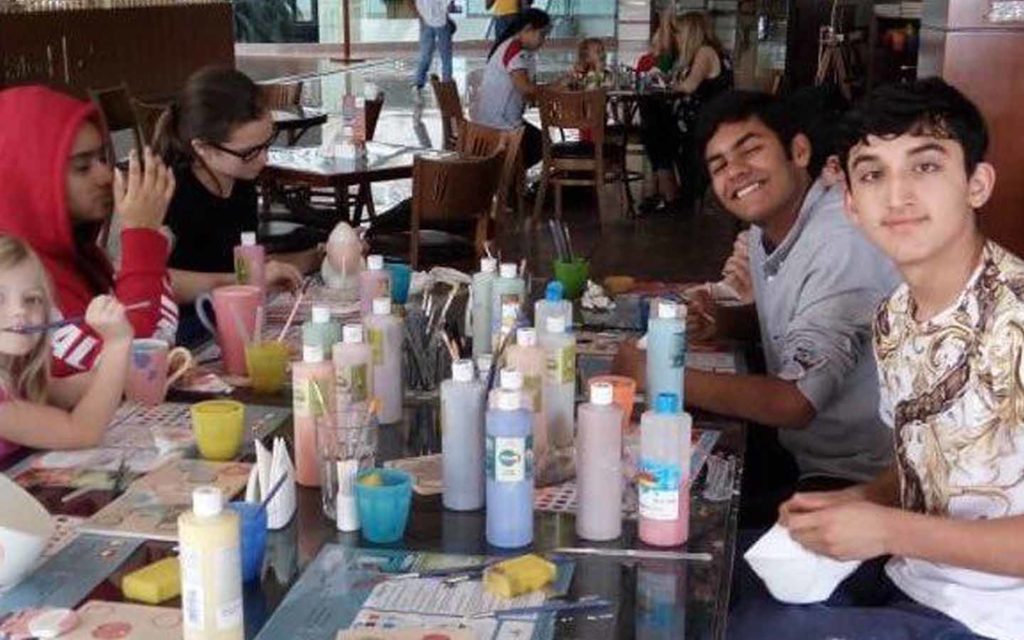 Boarding students sitting around a table