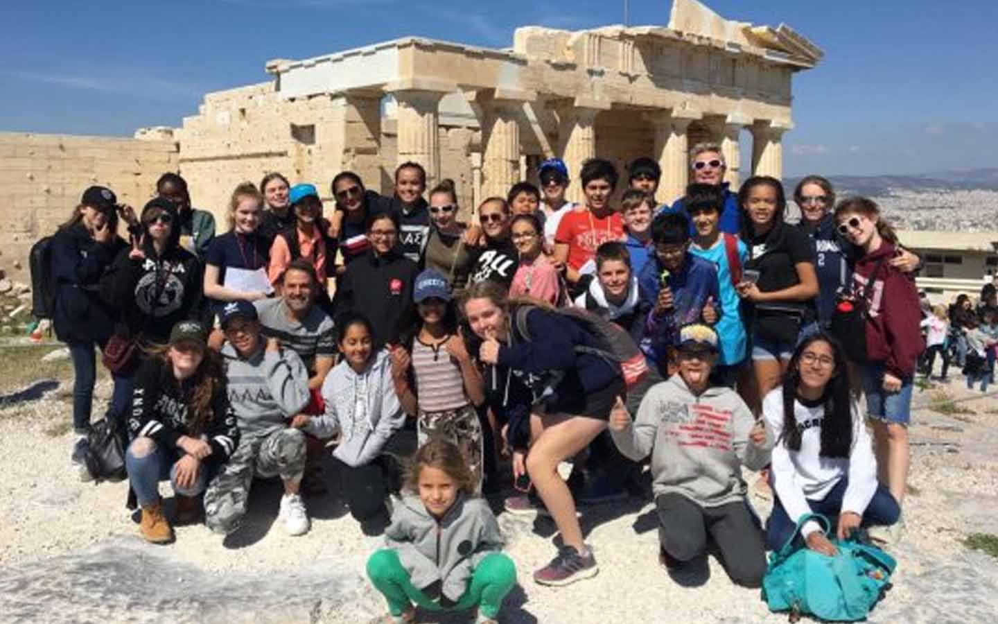 Students of Dubai College standing outside historic location in Greece