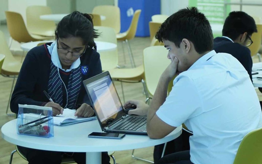 Students engaged in curricular activity at GEMS Wellington International School